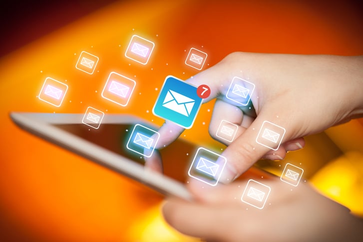 Female hands touching tablet with e-mail icons